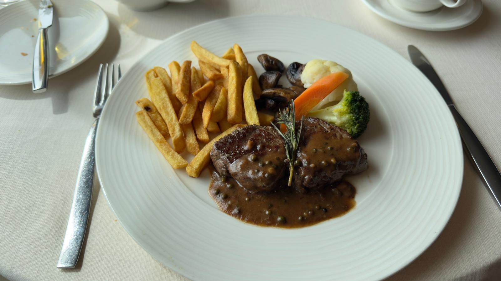 A plated gourmet dinner served onboard a Silversea Antarctica cruise