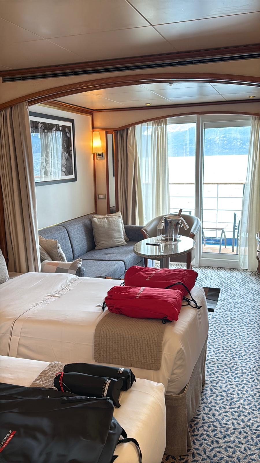 A Silversea suite interior with balcony view on an Antarctica expedition cruise