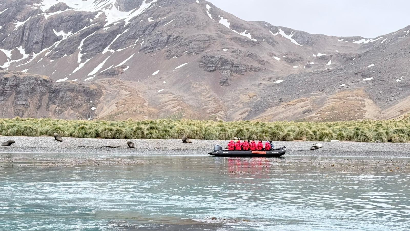 A zodiac excursion along the rugged coastline on a Silversea Antarctica voyage